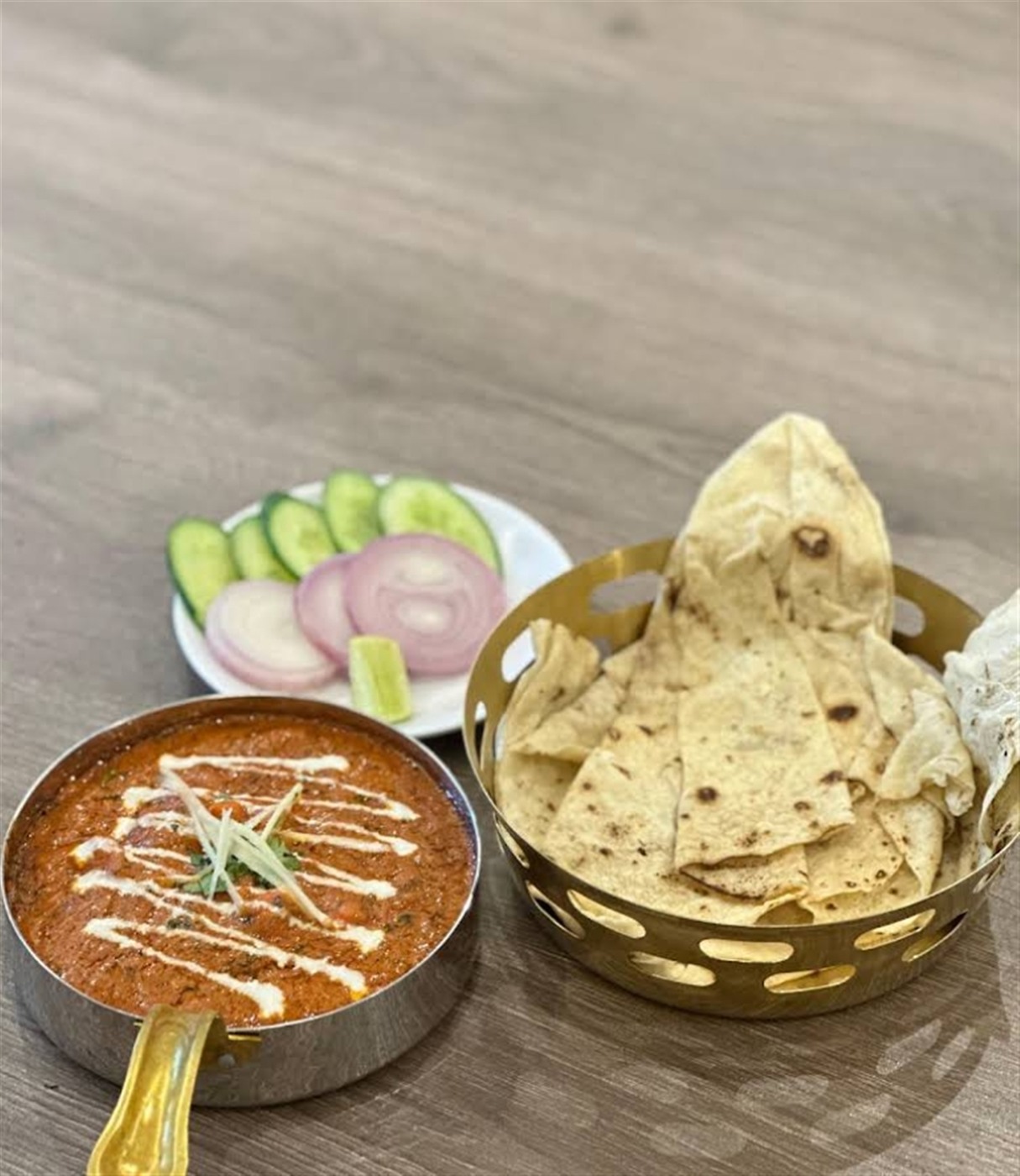 Butter chicken with naan and fresh salad