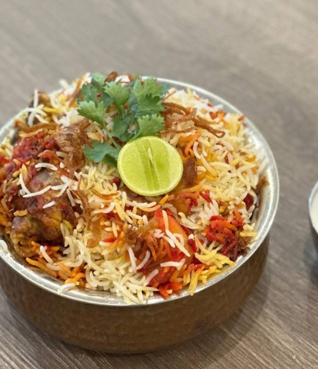 Teri Meri Zafrani biryani in a copper handi
